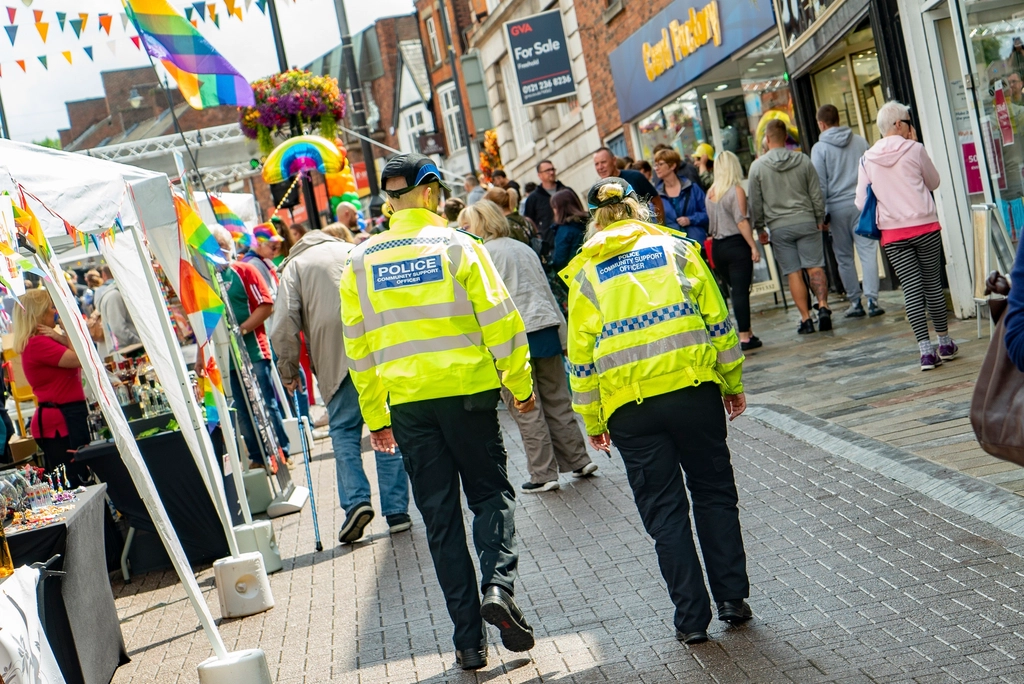 Police officers walking town, July